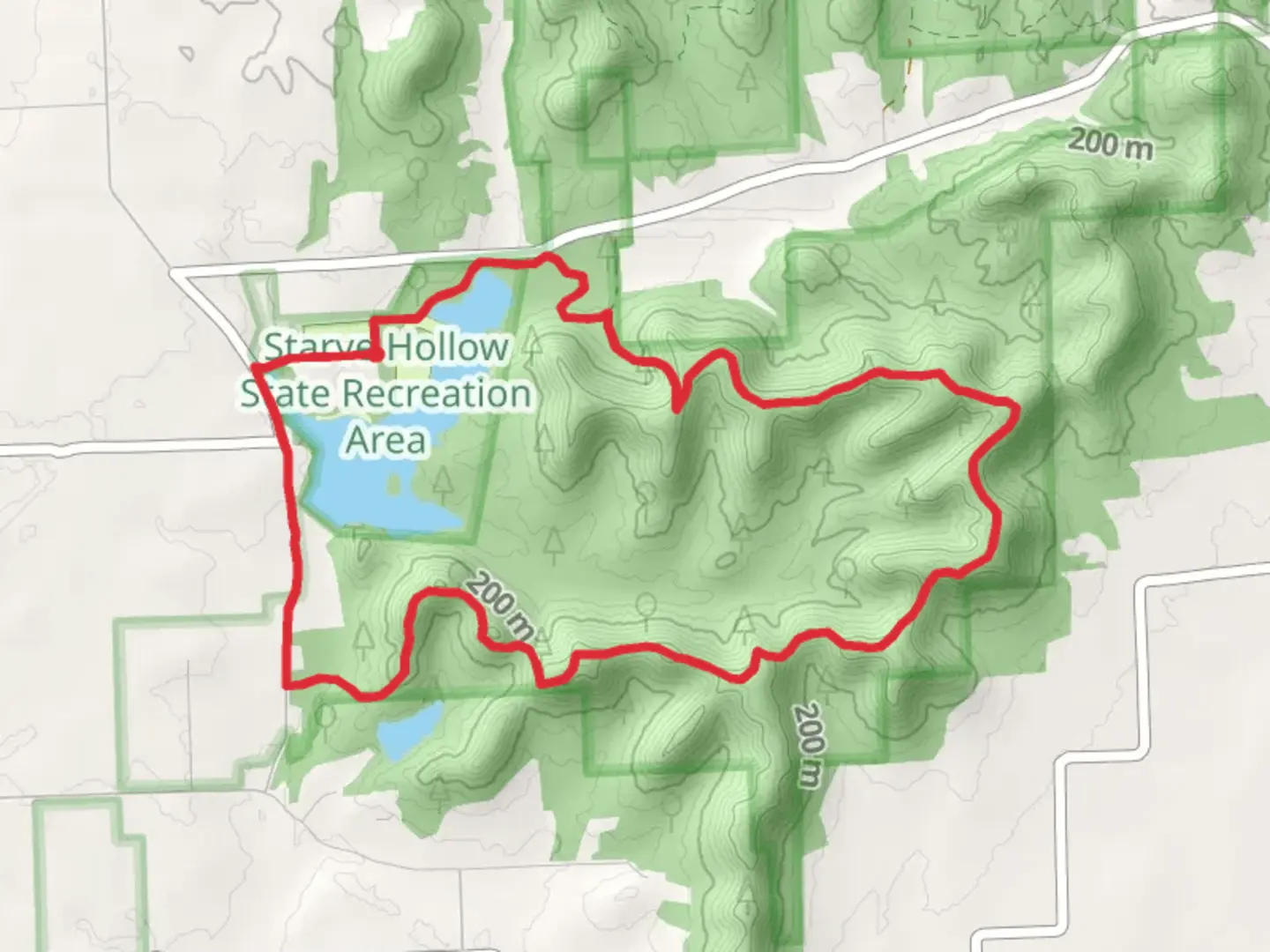 An image depicting the trail Starve Hollow Lake Loop and its surrounding area.