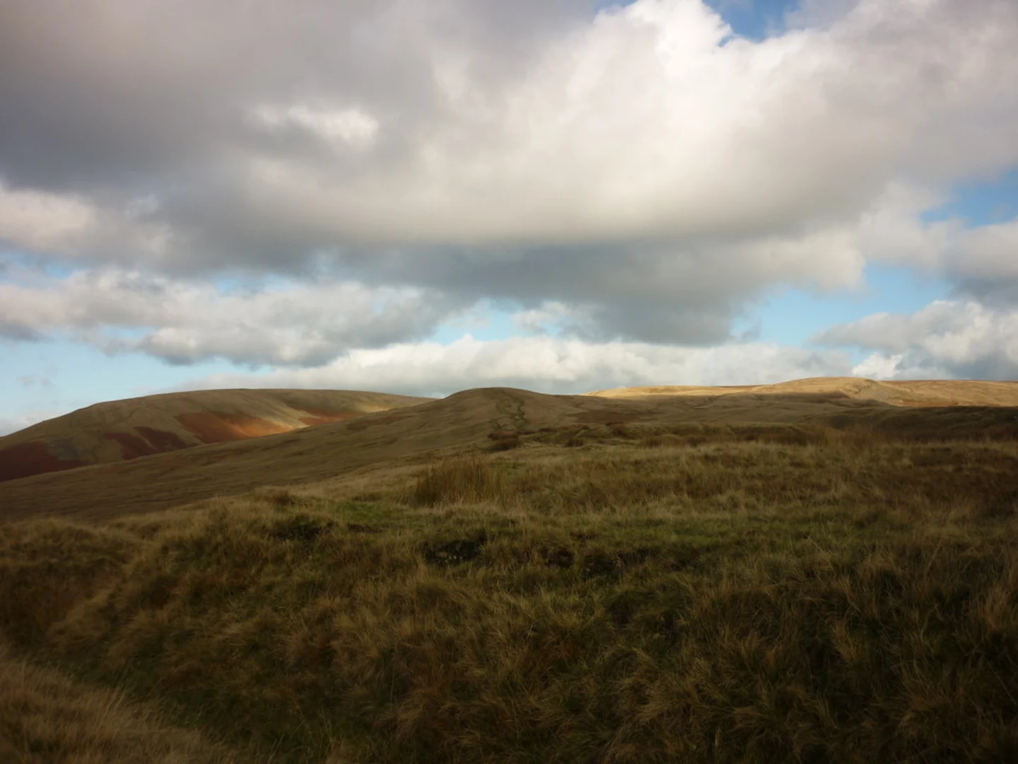 An image depicting the trail Pendle Hill from Nick O'Pendle and its surrounding area.