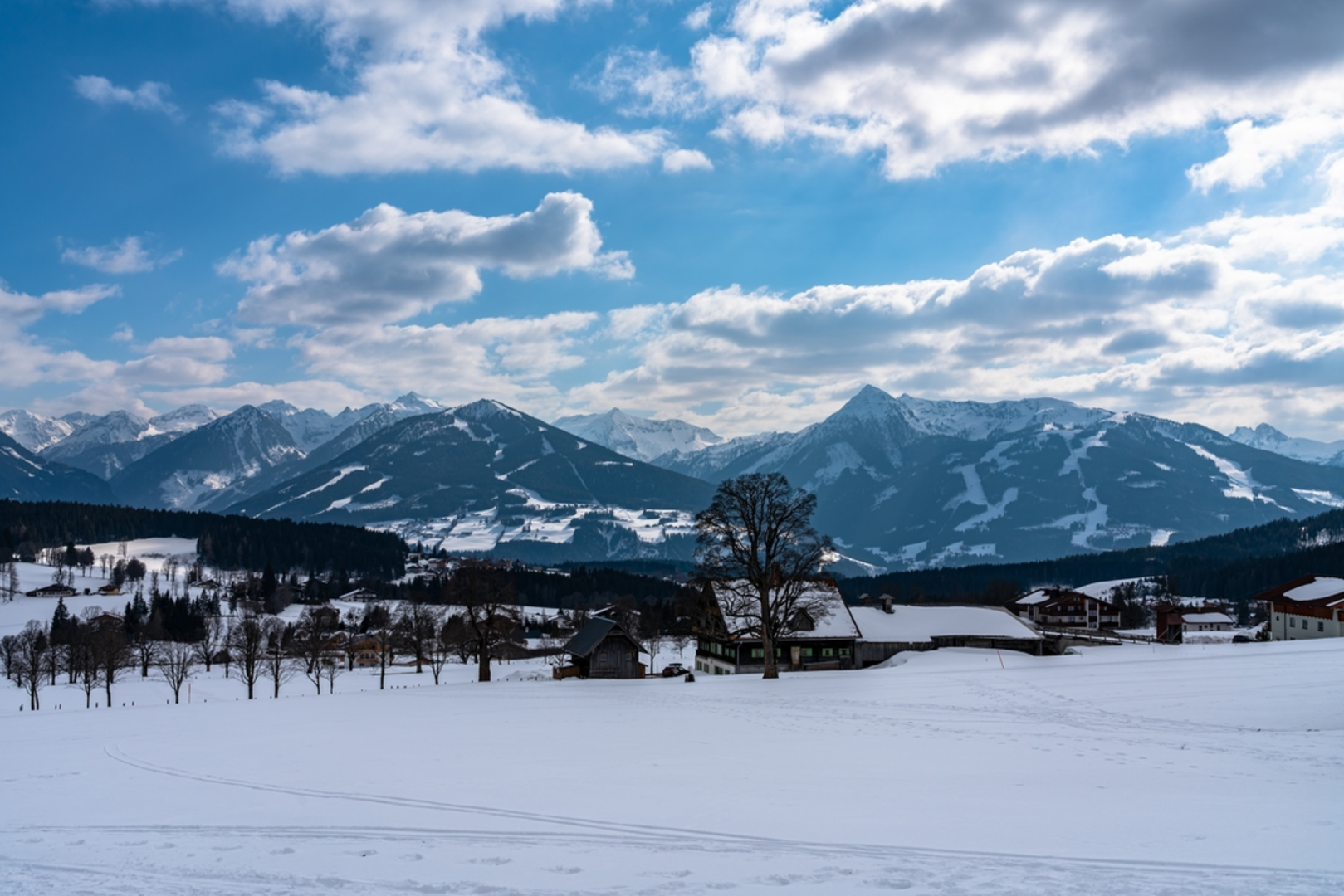 An image depicting the trail Summit of Hochwurzen to the Valley and its surrounding area.