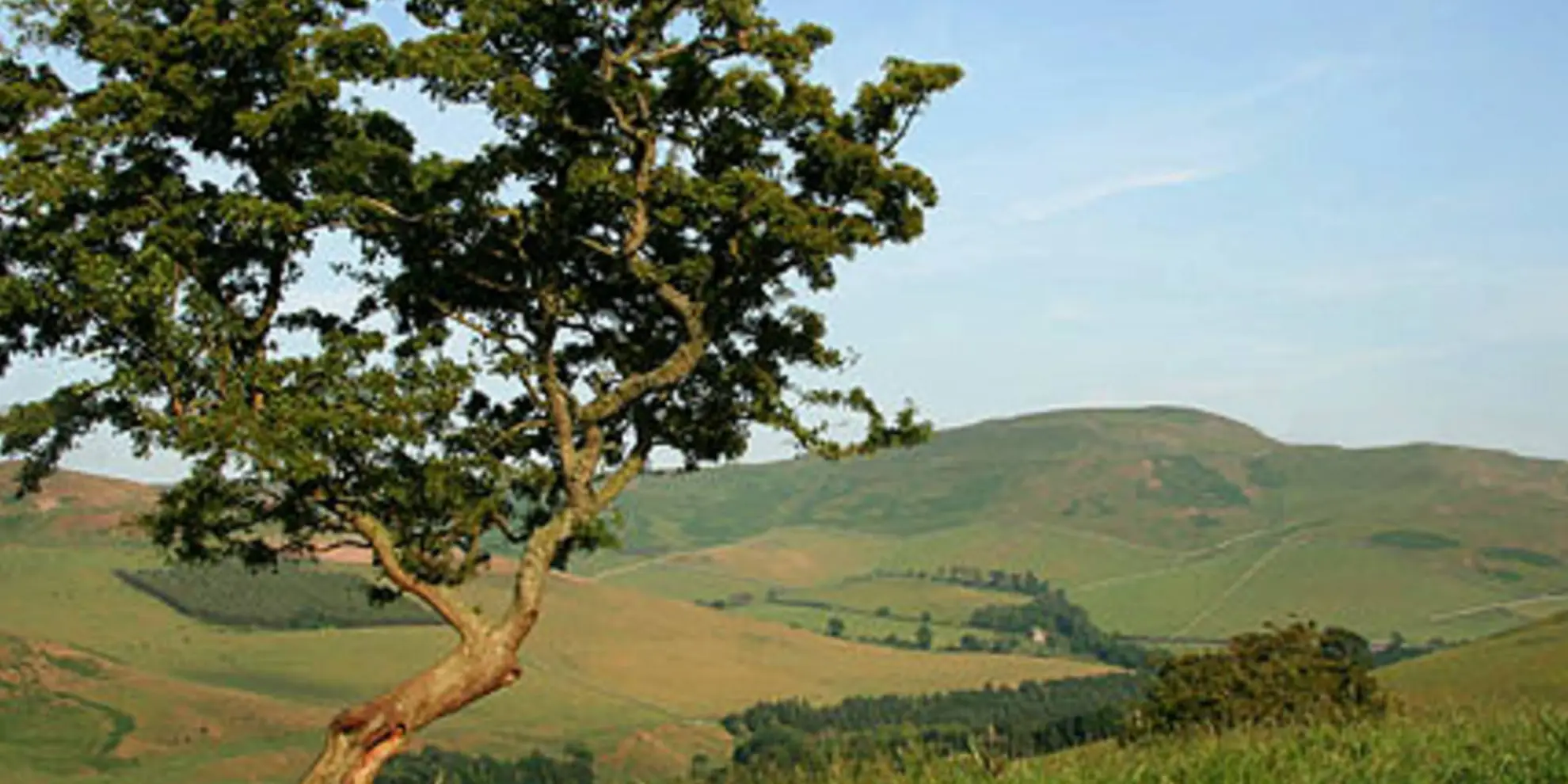 An image depicting the trail Grubbit Law and Hownam Law from Morebattle and its surrounding area.