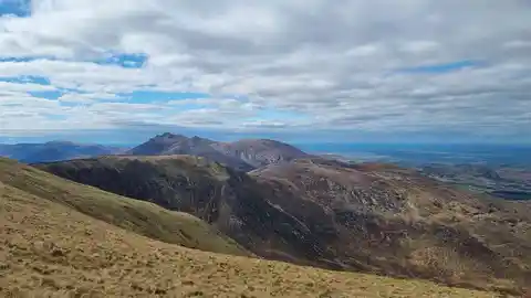 An image depicting the trail Slieve Commedagh and Slieve Donard Loop Trail and its surrounding area.