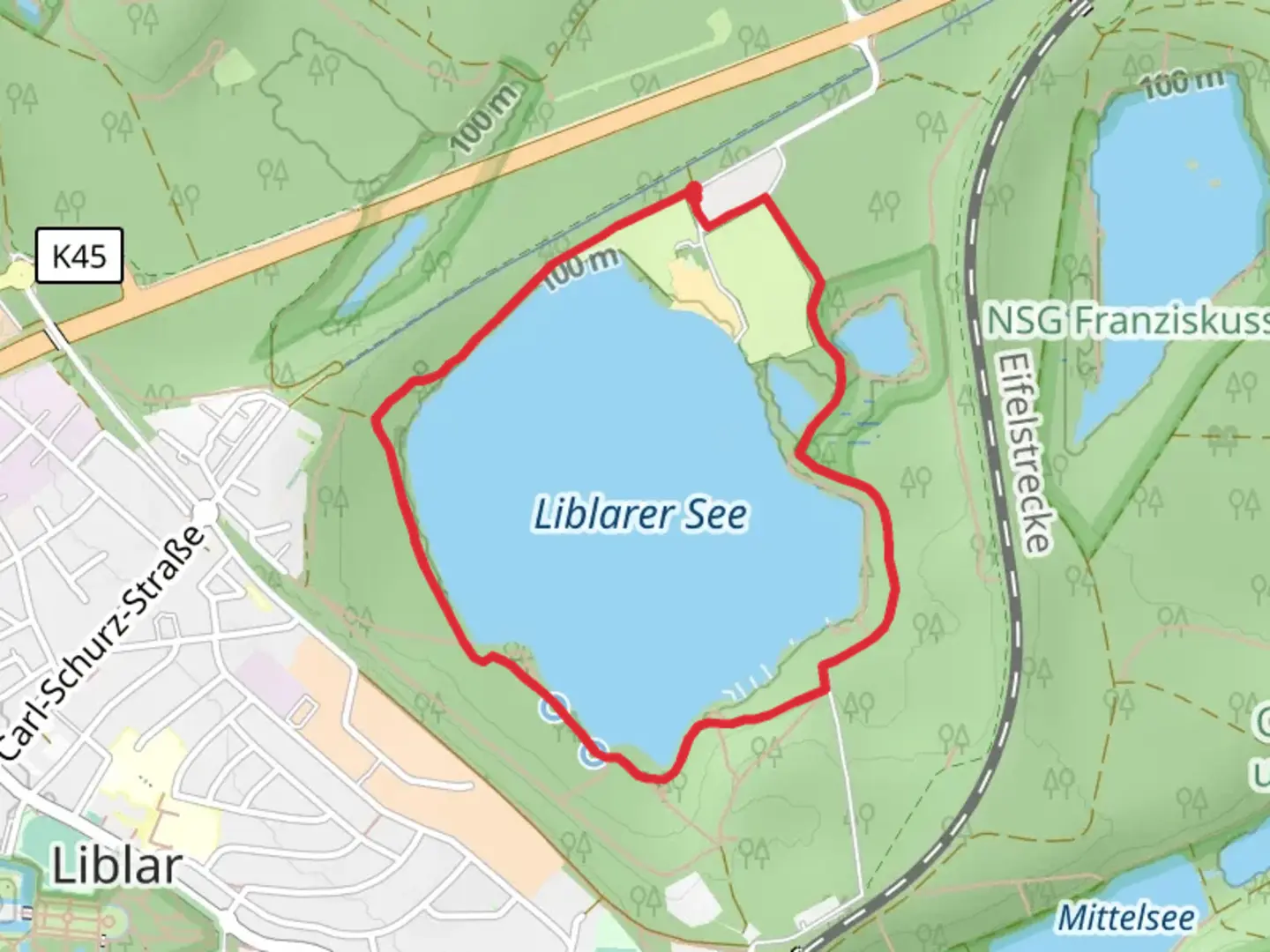 An image depicting the trail Liblarer See Loop via Seeneunde Ville A1 and its surrounding area.