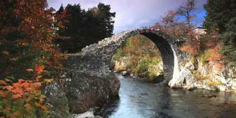 An image depicting the trail Carrbridge Path - Riverside Path and its surrounding area.