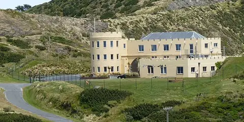 An image depicting the trail Wind Turbine, Te Kopahou and Red Rocks Loop and its surrounding area.
