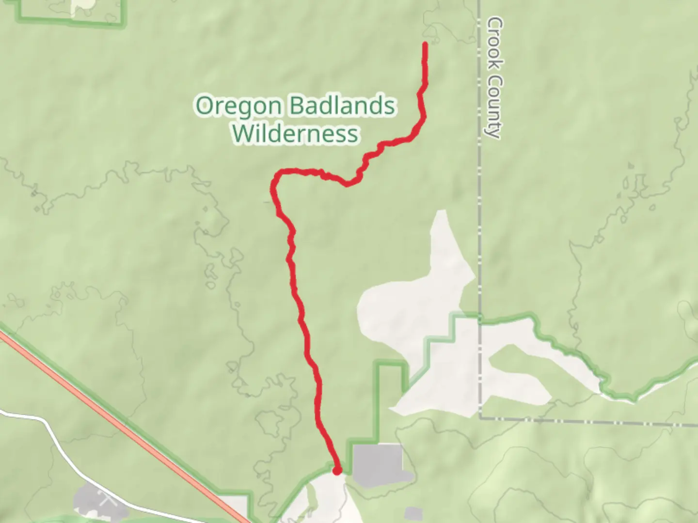 An image depicting the trail The Drive In and Badlands Rock Trail and its surrounding area.