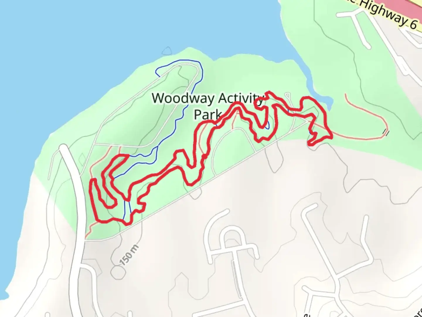 An image depicting the trail Woodway Park - Red and Green Loop and its surrounding area.