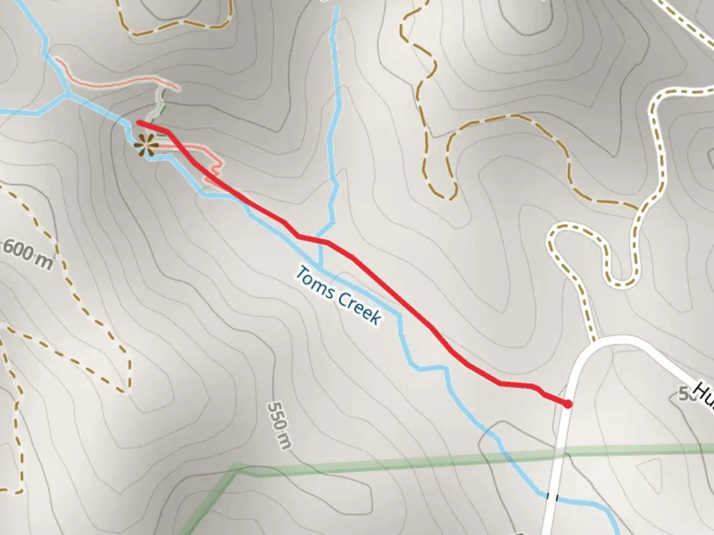 An image depicting the trail Toms Creek from Huskins Branch Road and its surrounding area.