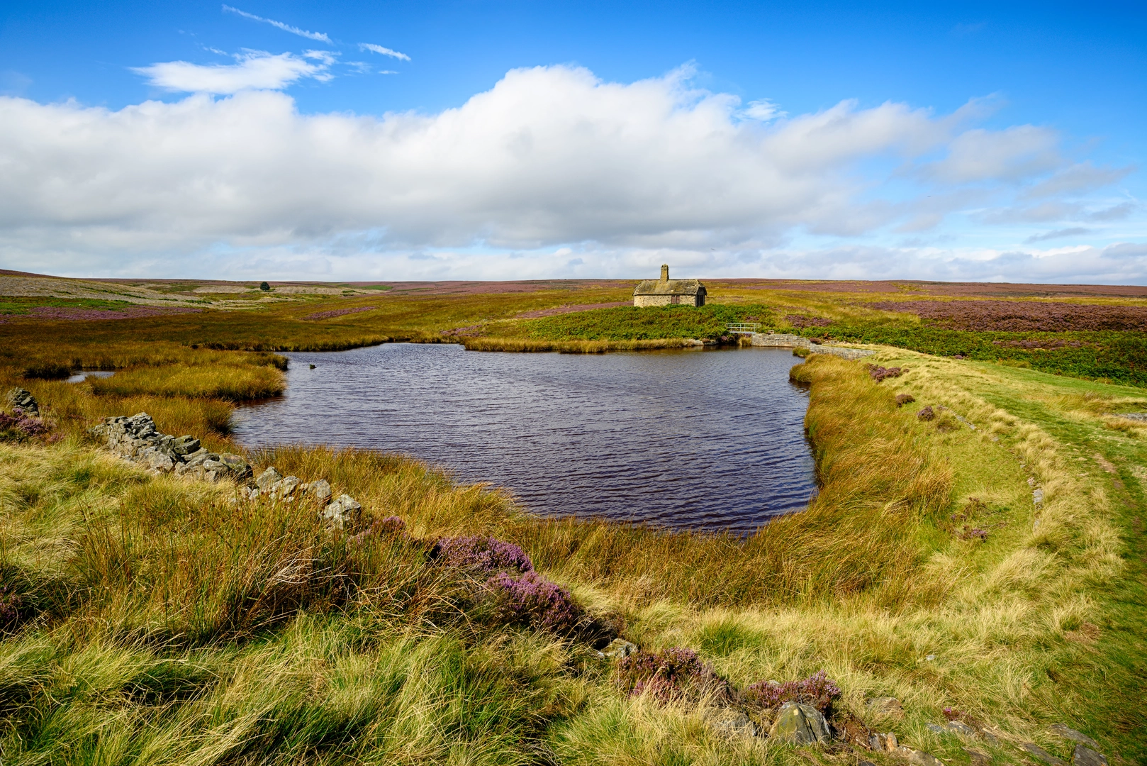 An image depicting the trail Redmires Reservoir and its surrounding area.