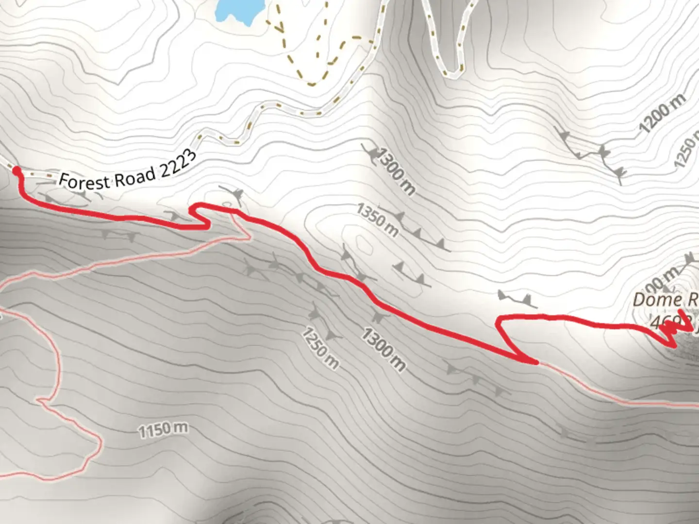 An image depicting the trail Dome Rock via Tumble Lake Trail and its surrounding area.