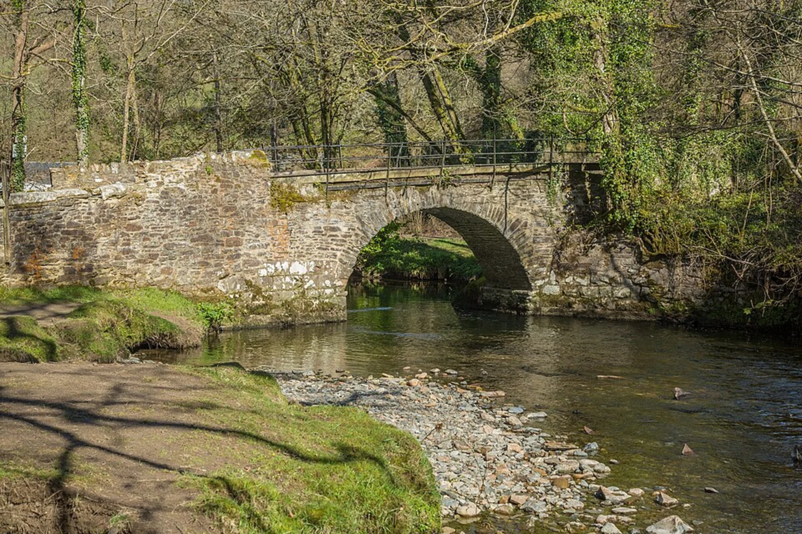 An image depicting the trail Sticklepath Wood and Bymore Wood via West Devon Way and its surrounding area.