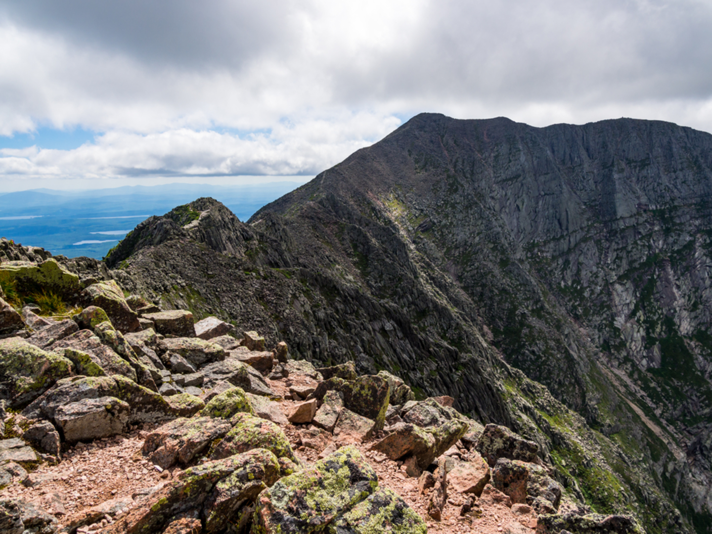 An image depicting the trail Pamola and Mount Katahdin Loop via Chimney Pond Trail and its surrounding area.