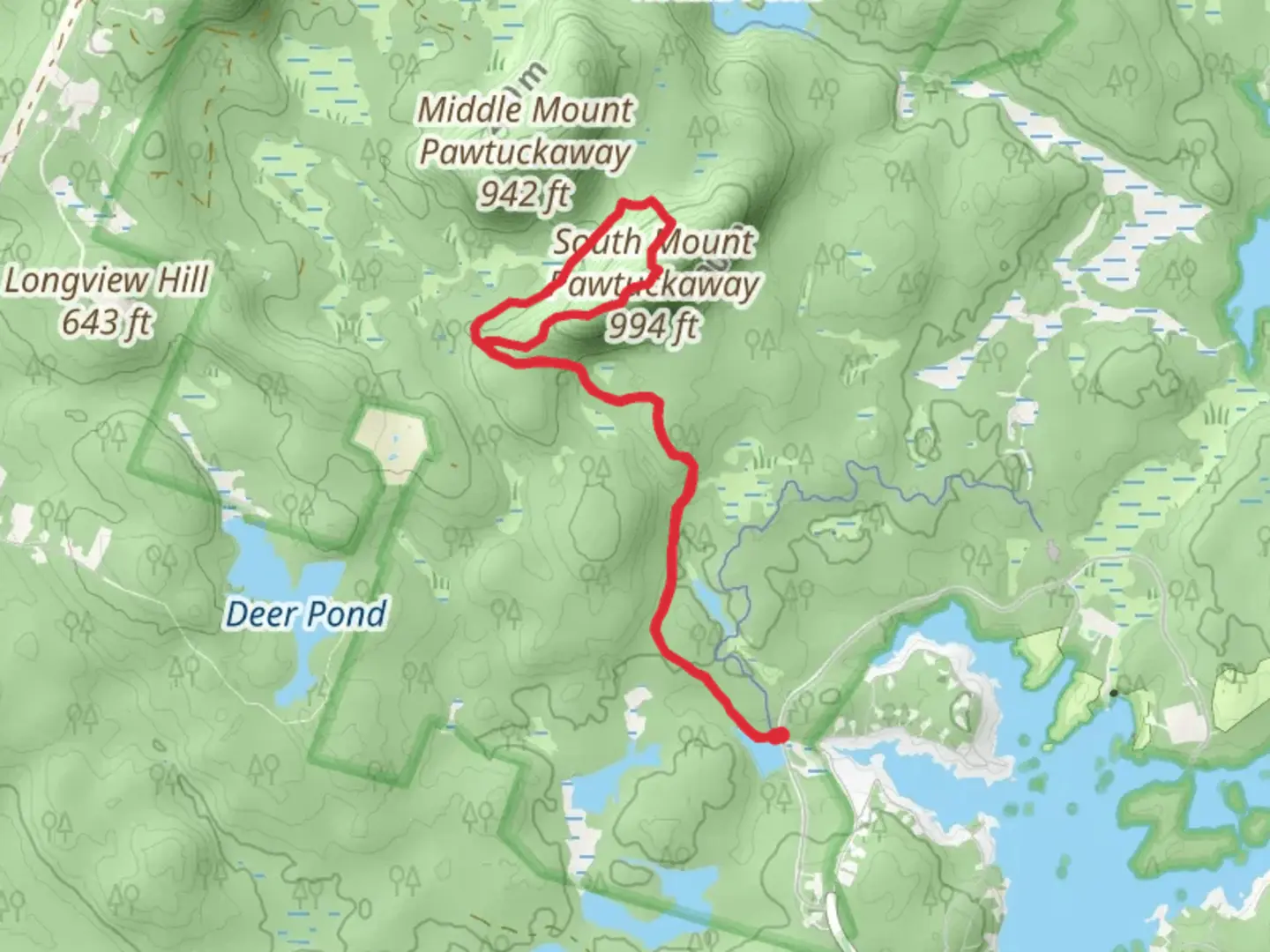 An image depicting the trail South Mount Pawtuckaway from Mountain Brook Pond and its surrounding area.