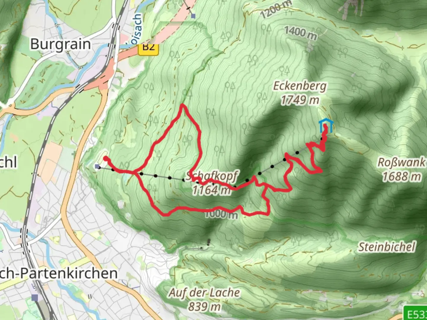 An image depicting the trail Schafkopf and Wank Loop via Alpina Violett A59 and its surrounding area.