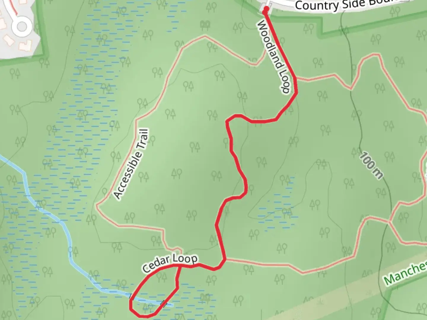 An image depicting the trail Woodland and Cedar Loop and its surrounding area.