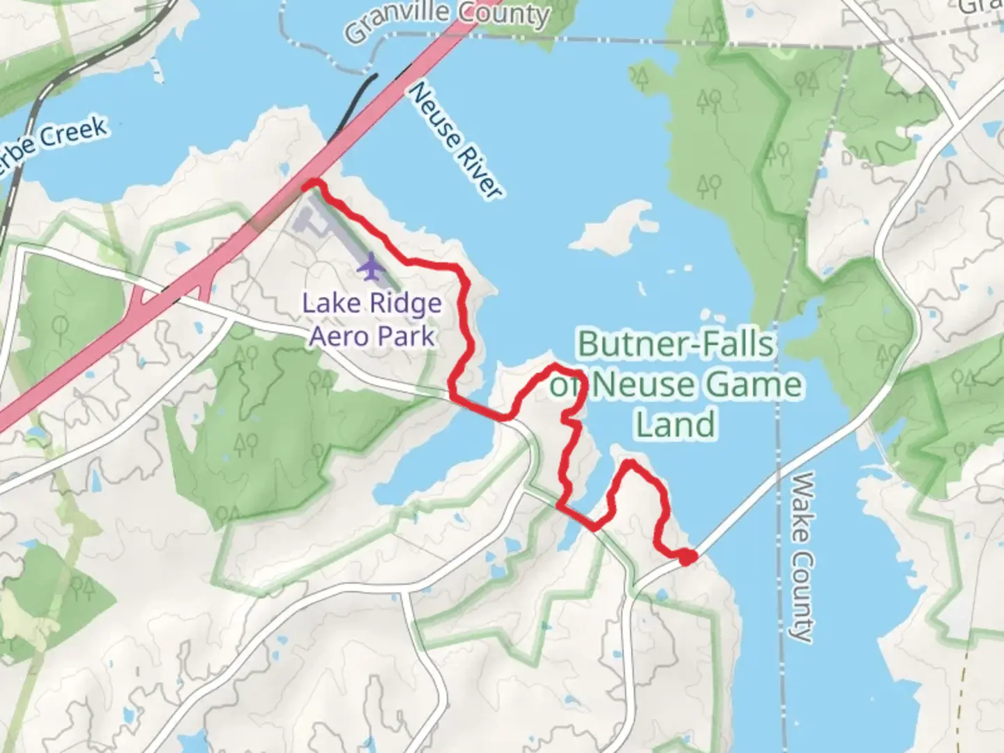 An image depicting the trail Falls Lake Trail along Neuse River and its surrounding area.