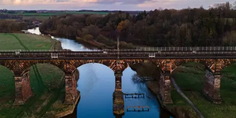 An image depicting the trail Acton Bridge - Woodhouse Hill and the River Weaver and its surrounding area.