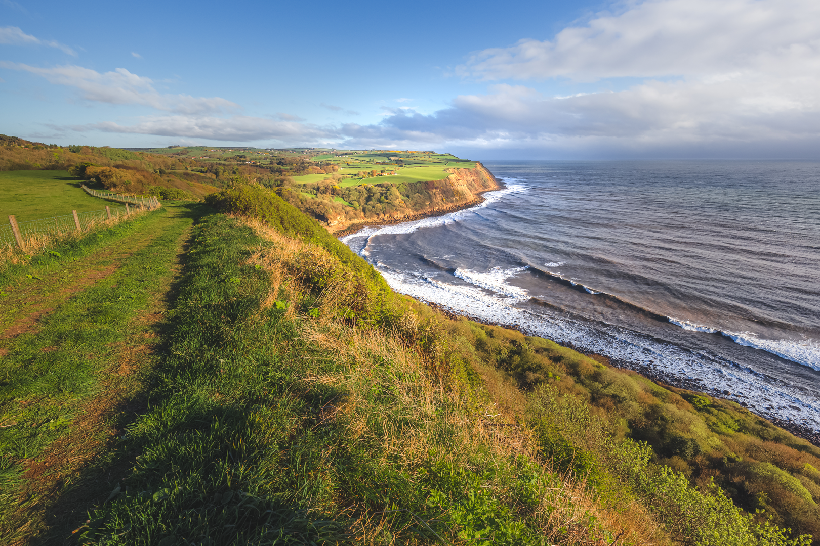 An image depicting the trail Hayburn Wyke from Ravenscar along the Cleveland Way and its surrounding area.