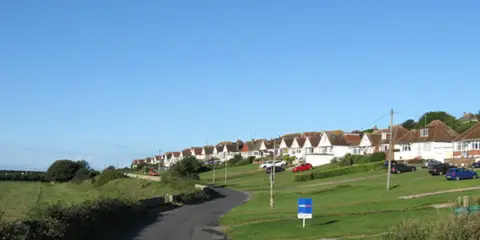 An image depicting the trail Bishopstone and the Downland Ridge and its surrounding area.