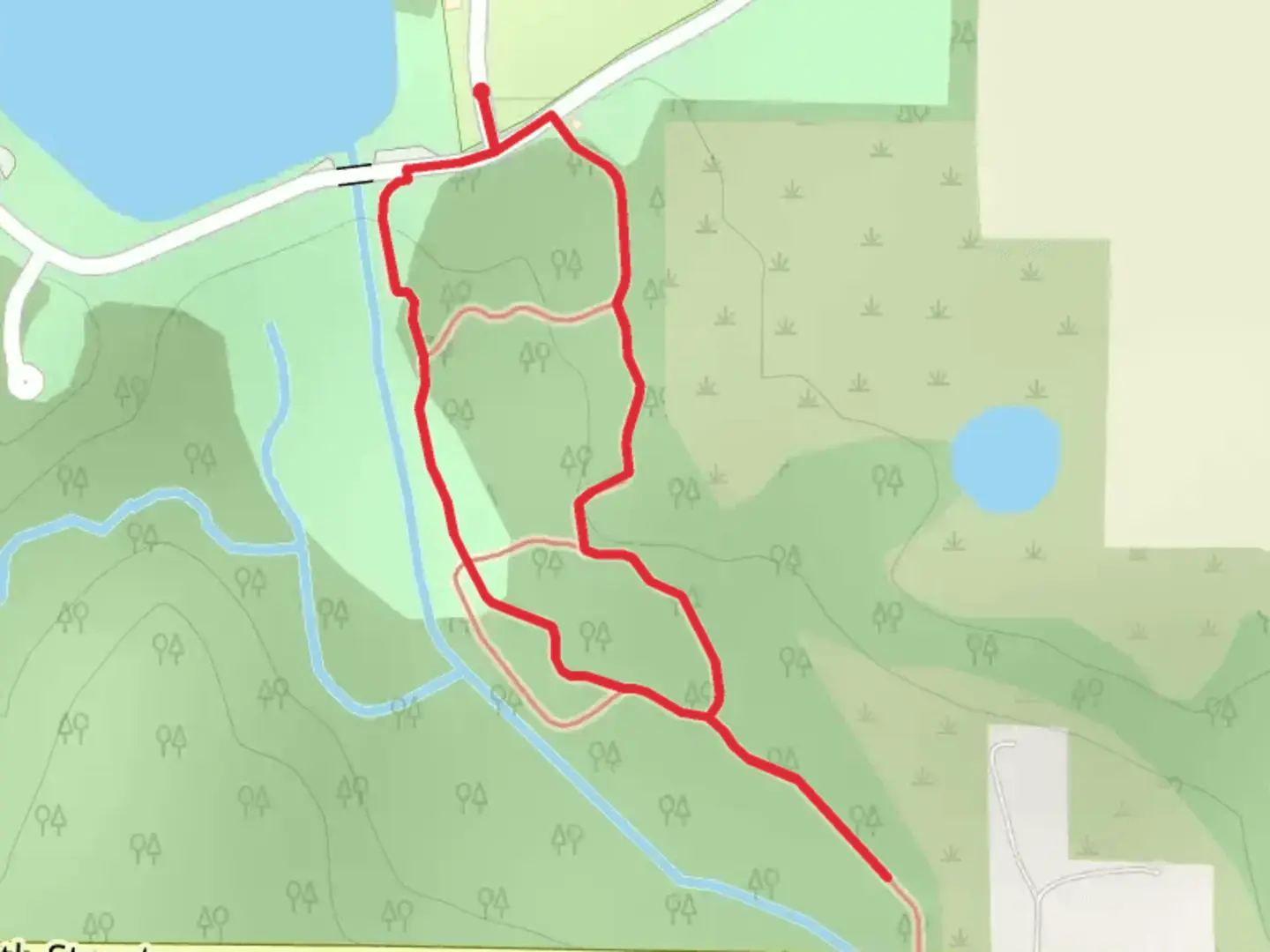 An image depicting the trail Hawkeye Lane Loop via Bluff Creek and its surrounding area.