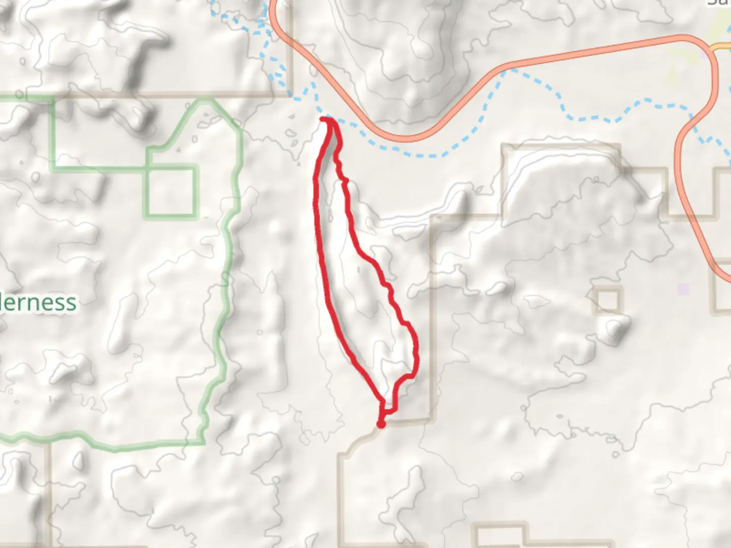An image depicting the trail Dragons Back - White Mesa Loop Trail and its surrounding area.