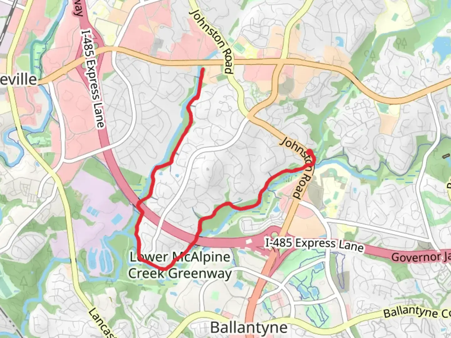 An image depicting the trail Lower McAlpine Creek Greenway and its surrounding area.