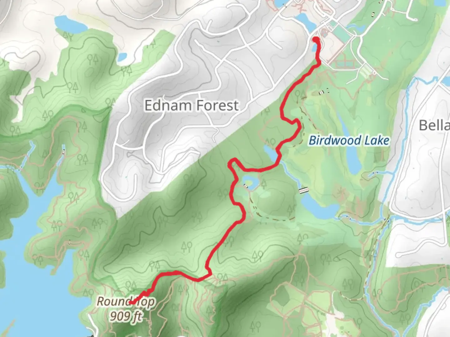 An image depicting the trail Round Top from Wellington Road and its surrounding area.