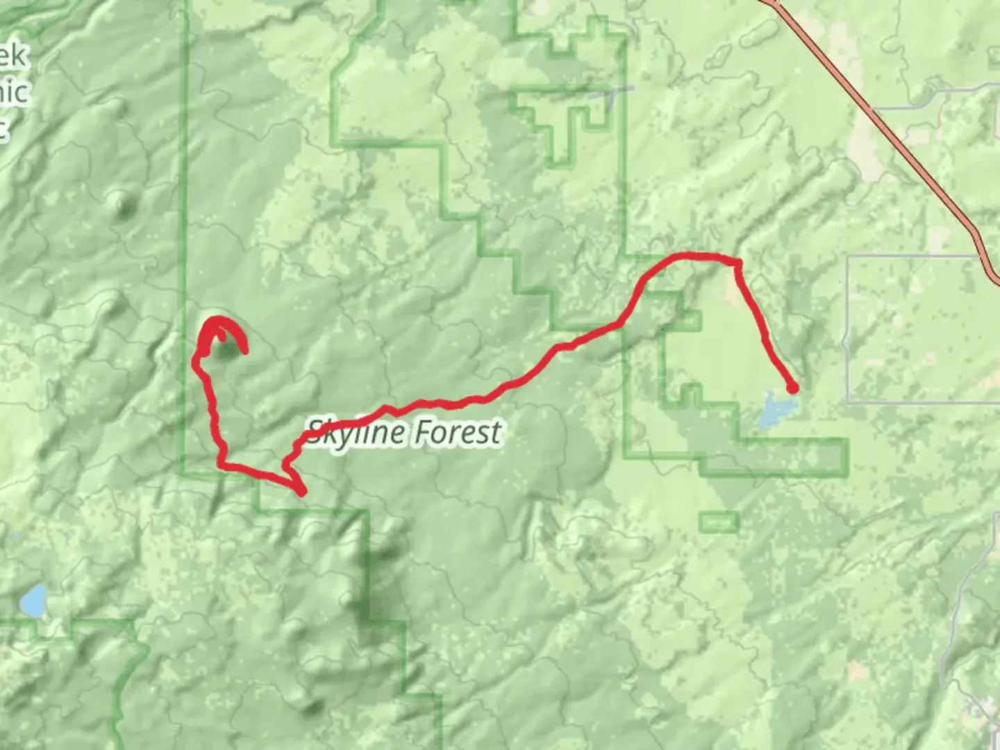 An image depicting the trail Three Creek Butte from Upper Tumalo Reservoir and its surrounding area.