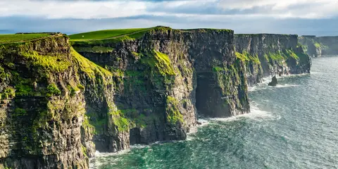 An image depicting the trail Cliffs of Moher Coastal Trail and its surrounding area.