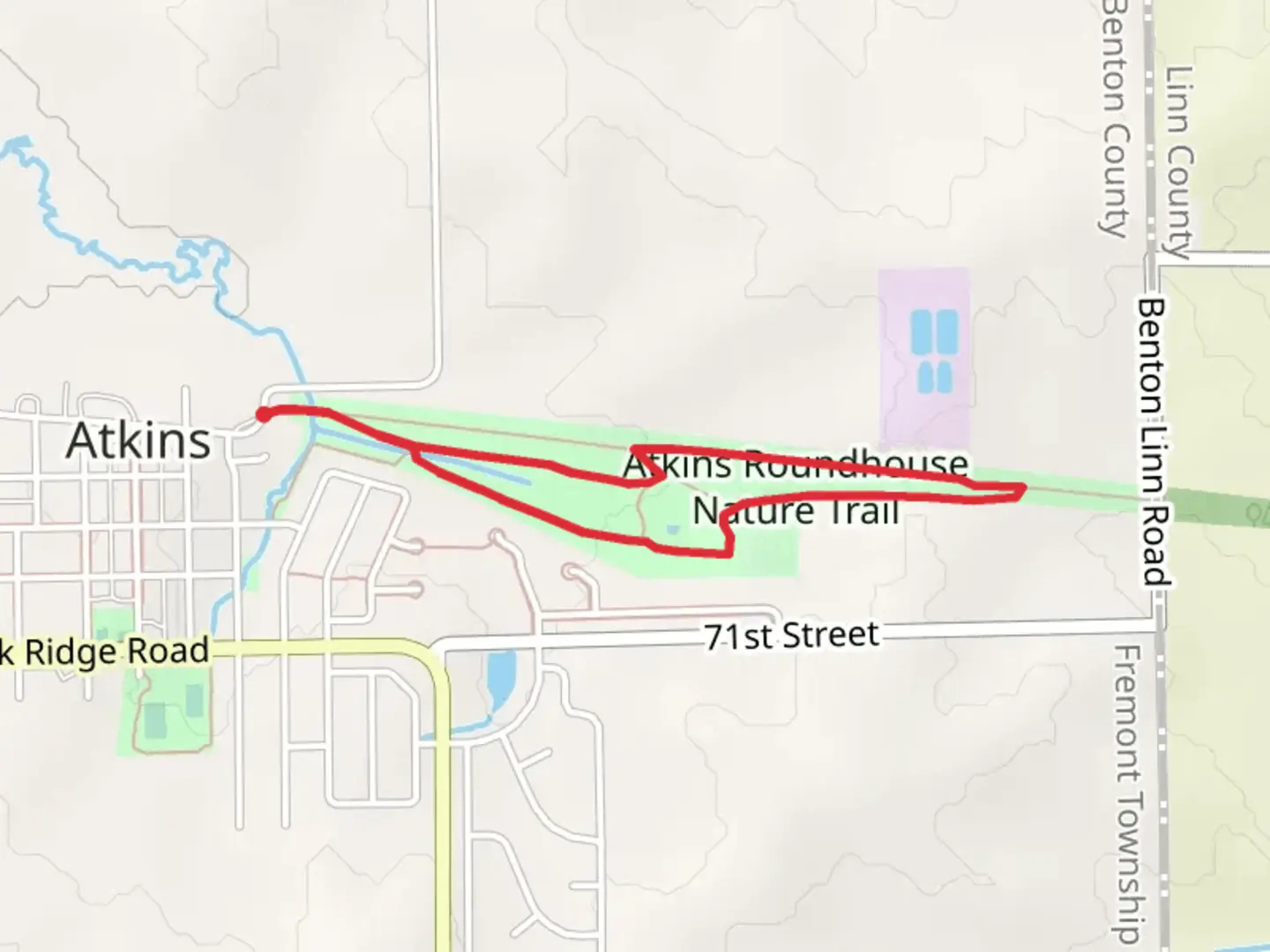 An image depicting the trail Atkins Roundhouse Nature Loop Trail and its surrounding area.