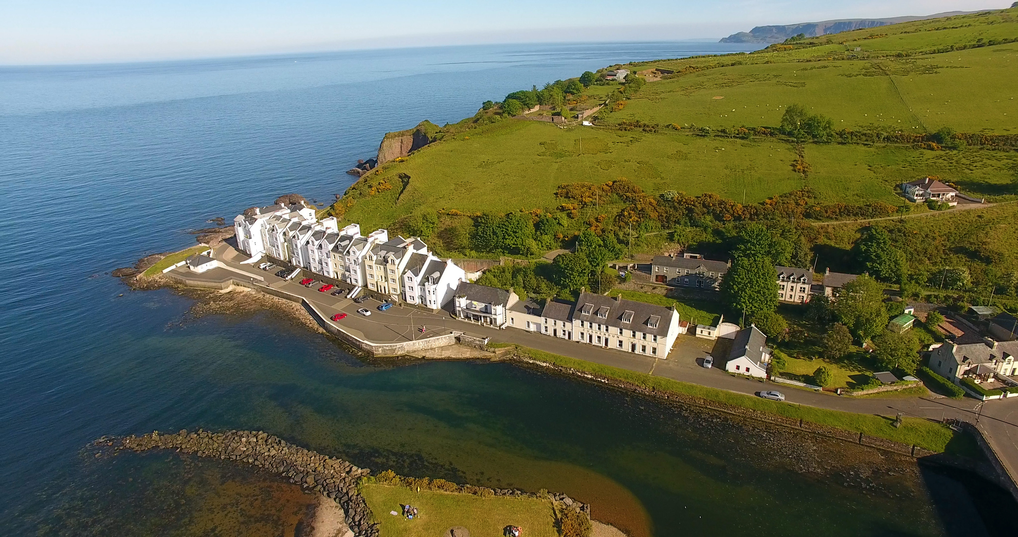 An image depicting the trail Cushendun Short Walk and its surrounding area.