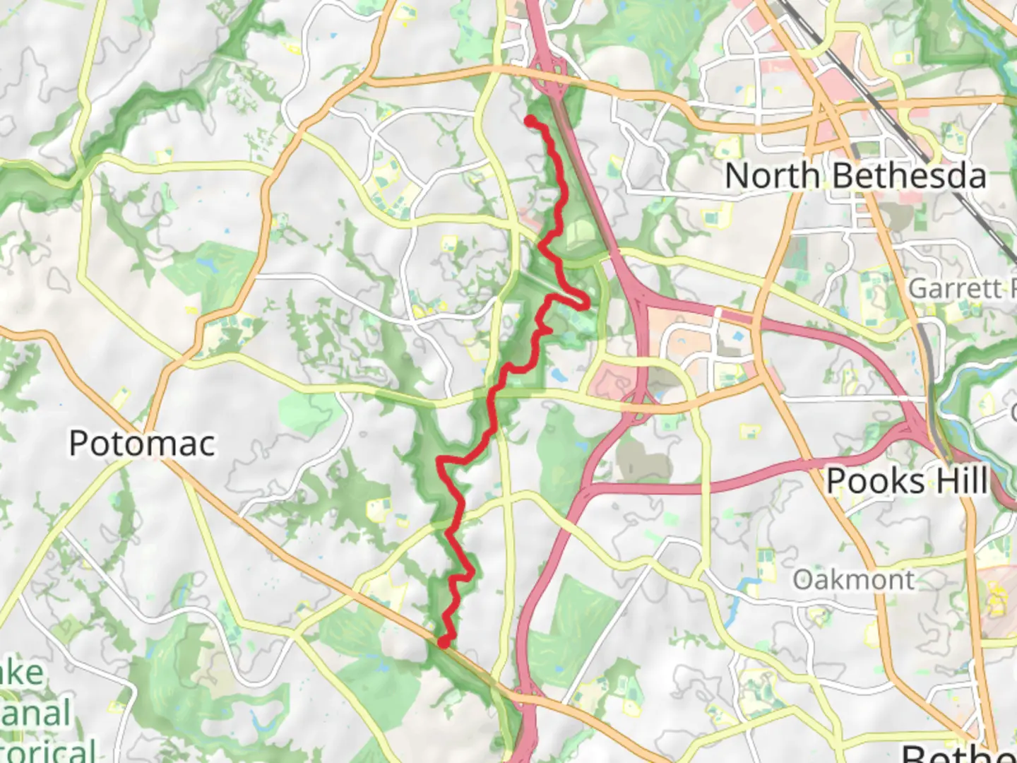 An image depicting the trail Cabin John Trail from Goya Road and its surrounding area.