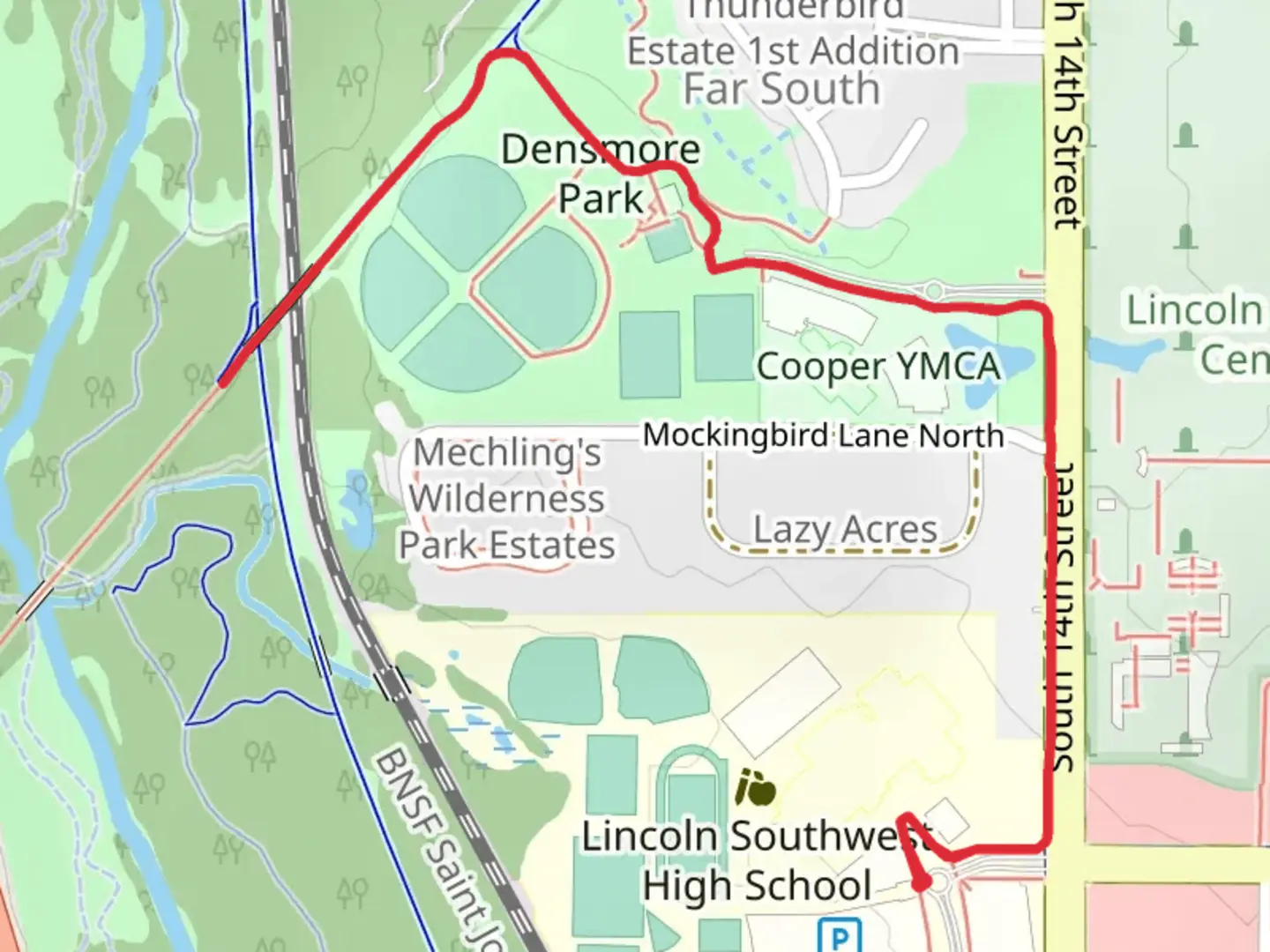 An image depicting the trail Rock Island Trail in Densmore Park and its surrounding area.