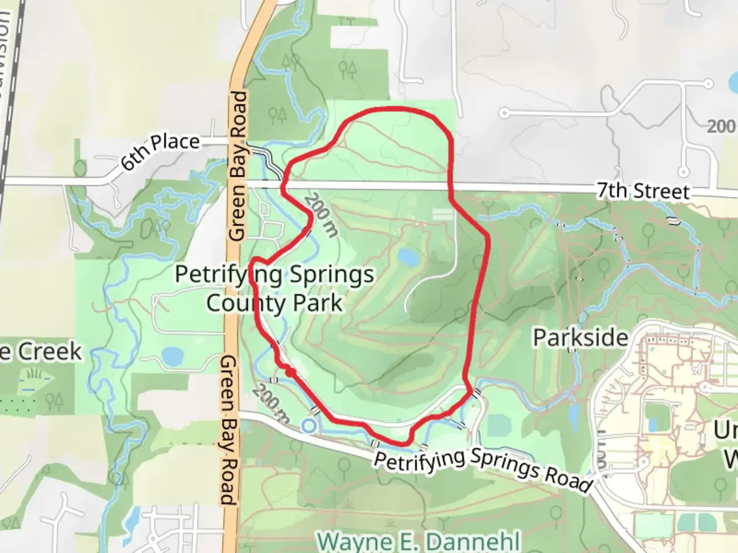 An image depicting the trail Petrifying Springs County Park Loop and its surrounding area.