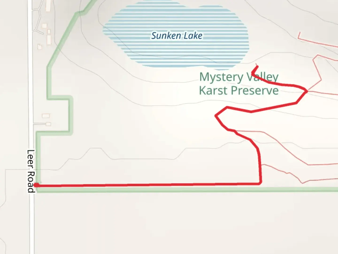 An image depicting the trail Mystery Valley Karst Preserve and its surrounding area.