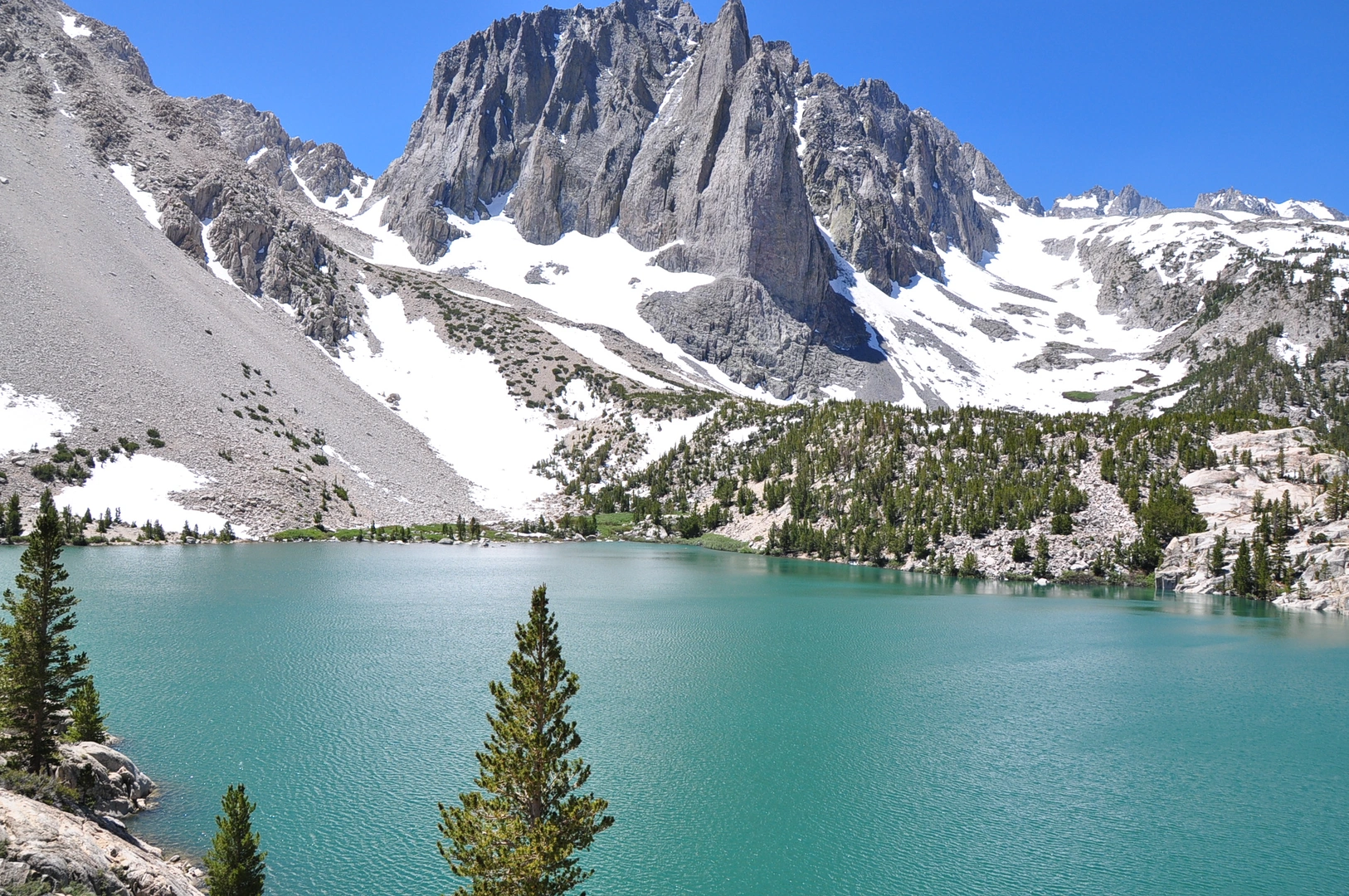 An image depicting the trail First to Seventh Lake via North Fork Big Pine Creek Trail and its surrounding area.