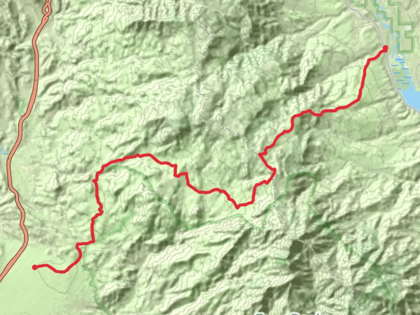 An image depicting the trail Four Peaks - El Oso Road and its surrounding area.