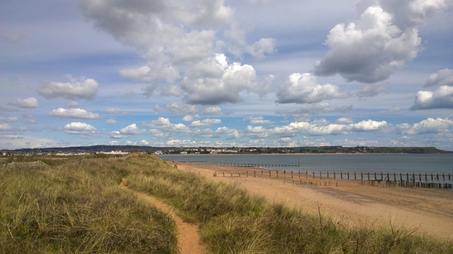 An image depicting the trail Dawlish Warren to Exeter along the South West Coast Path and Exe Estuary Trail and its surrounding area.