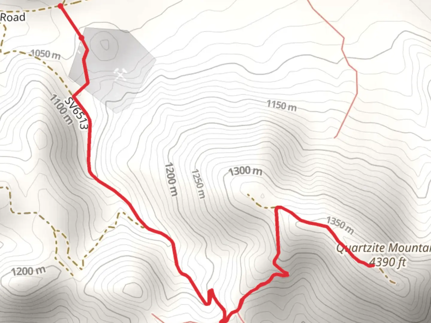 An image depicting the trail Quartzite Mountain from Oro Grande Canyon Road and its surrounding area.