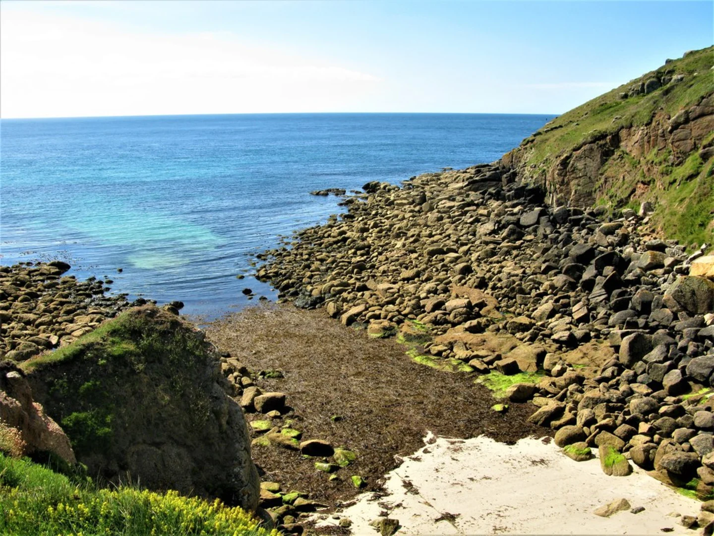 An image depicting the trail National Coastwatch Institution Loop - Porthgwarra and its surrounding area.