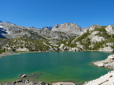 An image depicting the trail Sixth Lake via North Fork Big Pine Creek Trail and its surrounding area.