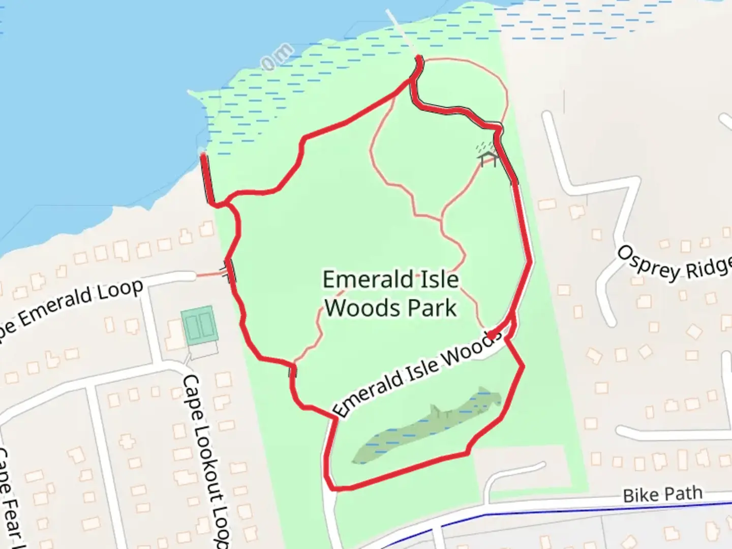 An image depicting the trail Emerald Isle Woods Park Loop and its surrounding area.