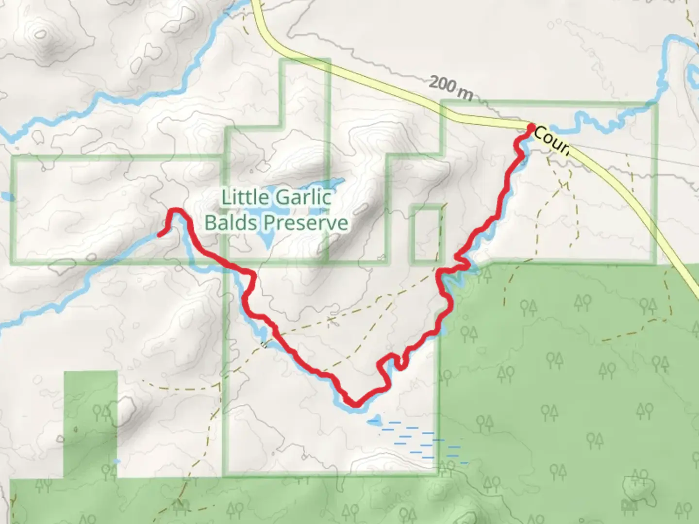 An image depicting the trail Little Garlic Falls Trail and its surrounding area.
