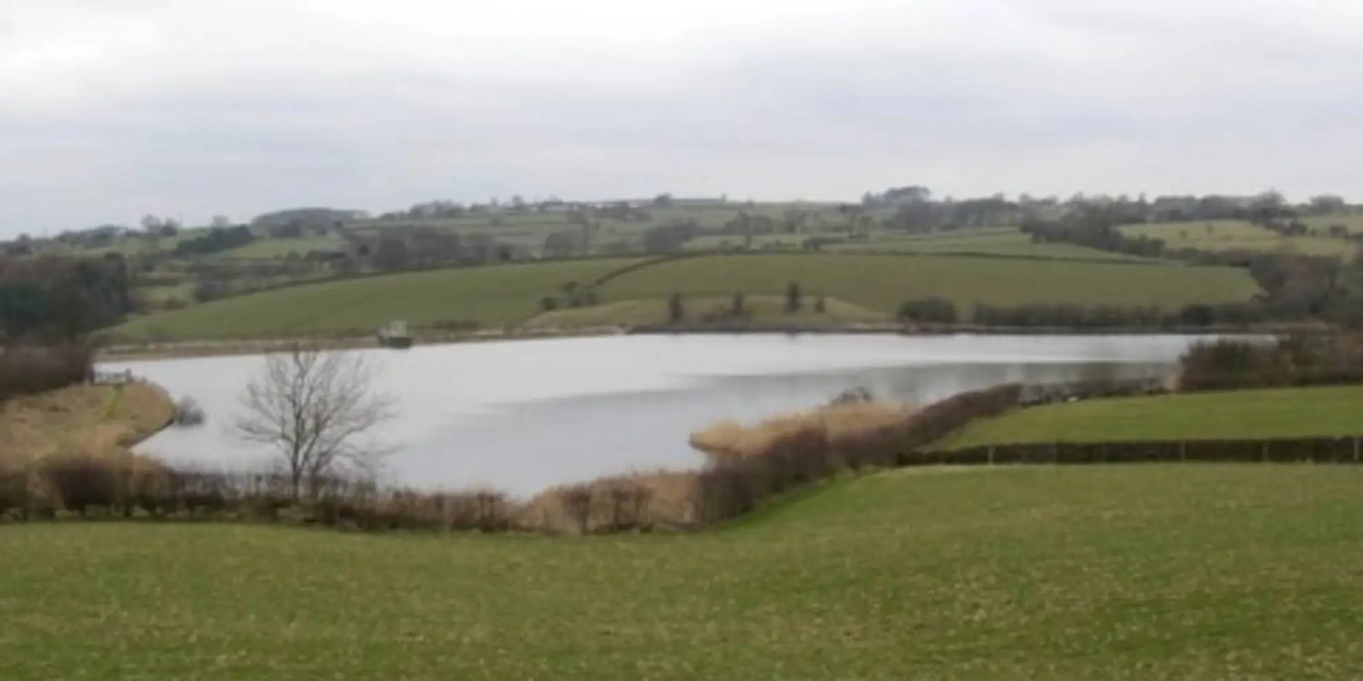 An image depicting the trail Around Silsden Reservoir and its surrounding area.