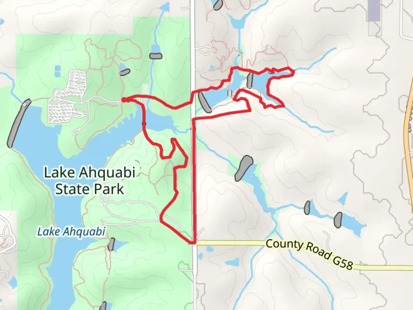 An image depicting the trail Lake Ahquabi State Park and Lake Ahquabi Loop and its surrounding area.