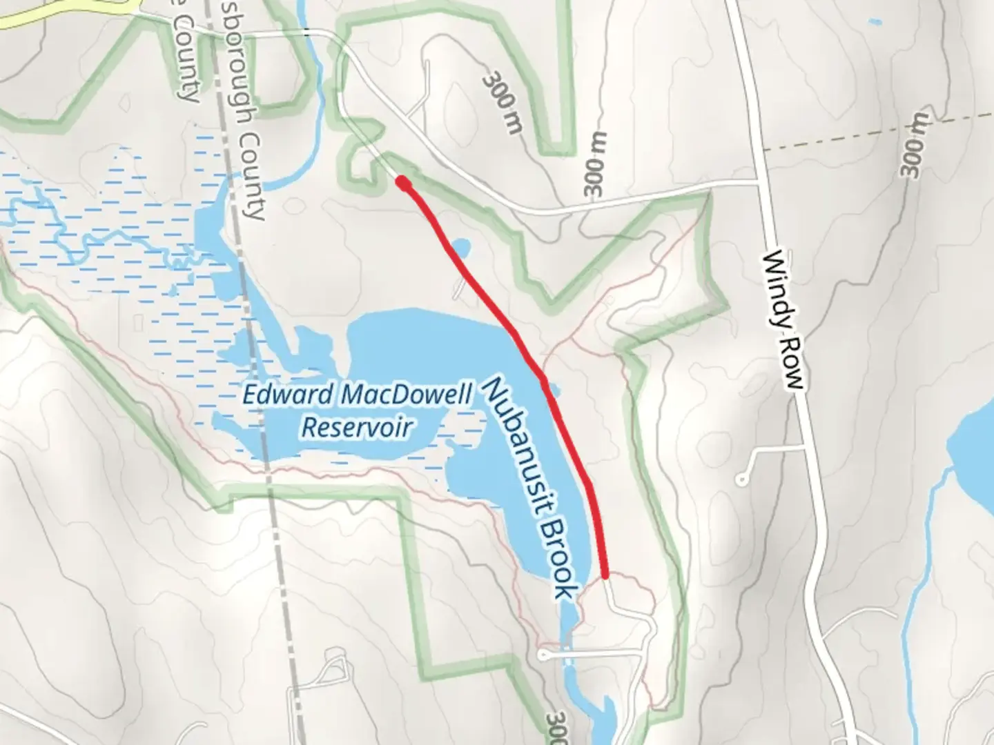 An image depicting the trail Edward MacDowell Reservoir and its surrounding area.