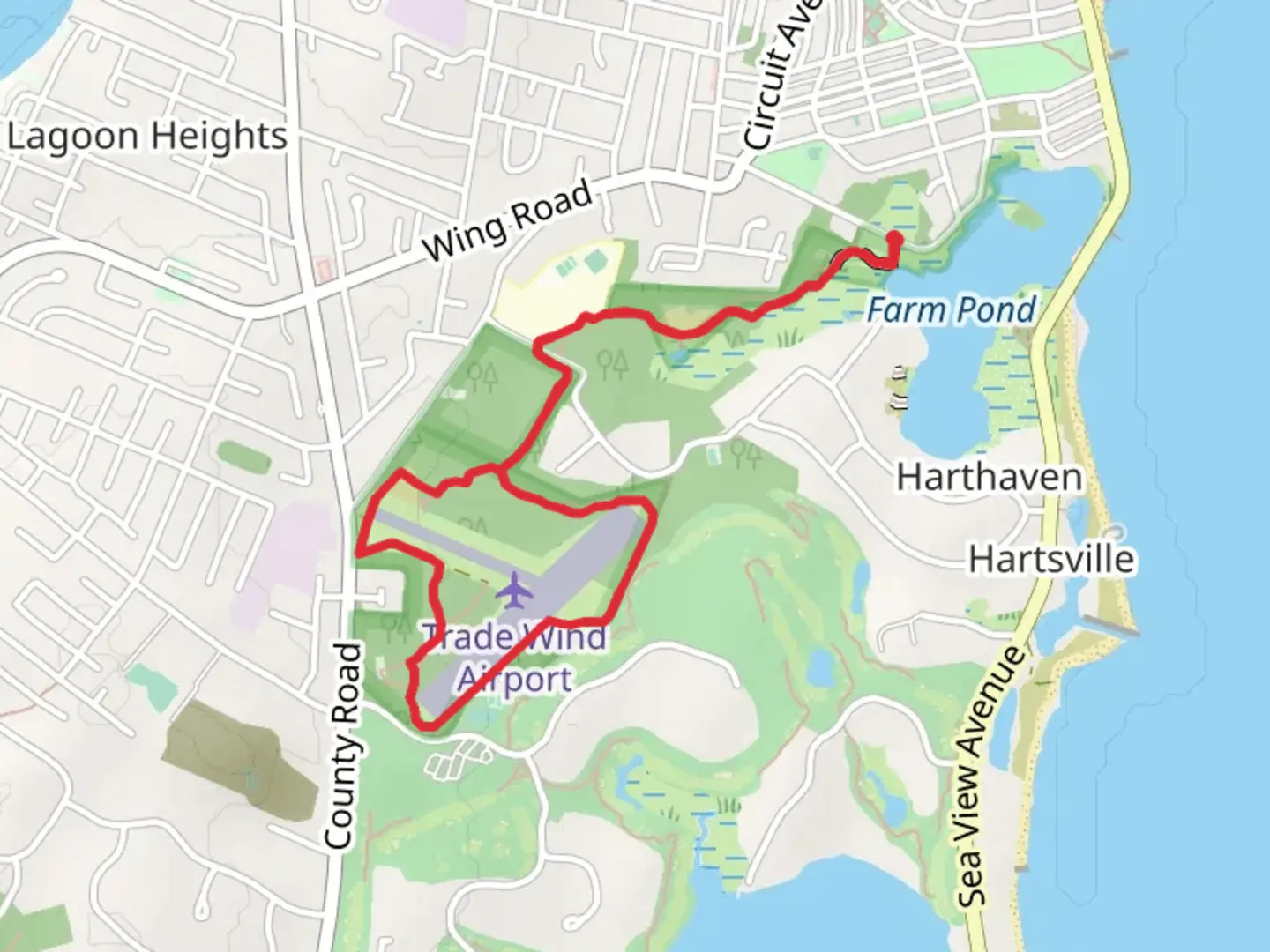 An image depicting the trail Trade Winds Field Preserve from South Circuit Avenue and its surrounding area.