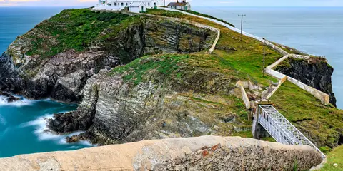 An image depicting the trail Anglesey Coastal Path and its surrounding area.