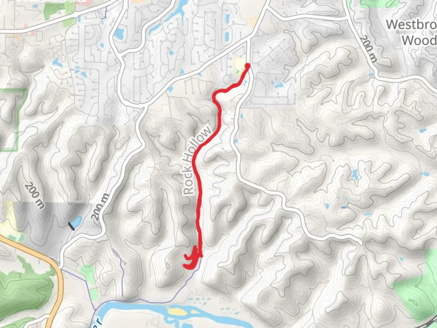 An image depicting the trail Rock Hollow Greenway and its surrounding area.