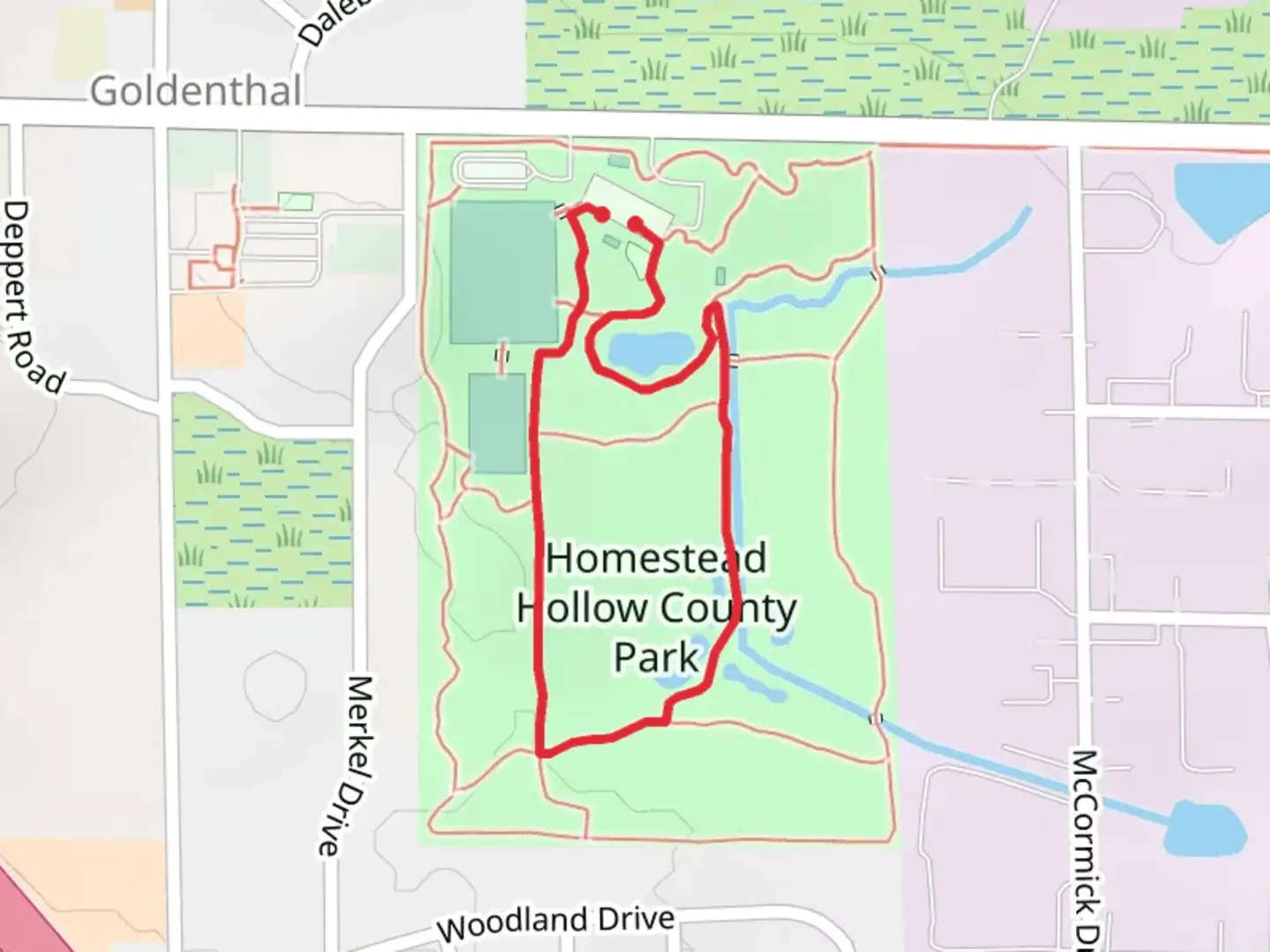 An image depicting the trail Red and Black Loop Trail - Homestead Hollow Park and its surrounding area.
