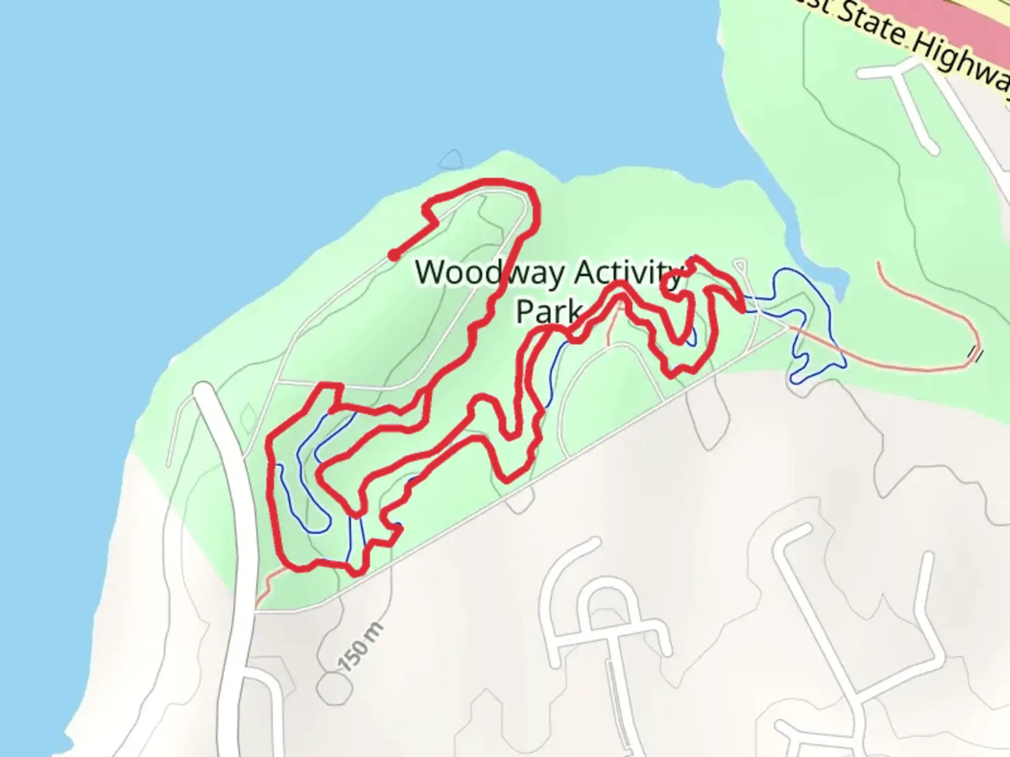 An image depicting the trail Woodway Park Loop and its surrounding area.